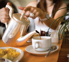 Pouring a cup of tea in a cozy setting